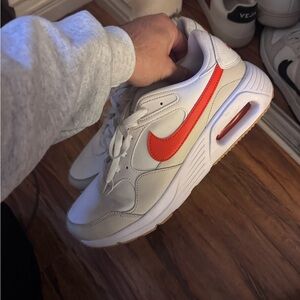 Nike White Sneakers with Bold Orange Swoosh